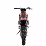 Red dirt bike rear view with knobby tire
