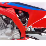 Motorcycle rear shock absorber with gas reservoir