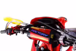 Red dirt bike handlebar with yellow grip and Factory logo