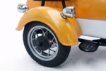Orange three-wheel vehicle front wheel and fender detail