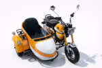 Orange and white motorcycle with sidecar on white background