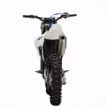 White dirt bike rear view with exhaust