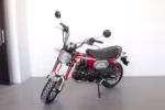 Red mini motorcycle with black seat