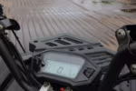 Motorcycle digital dashboard display showing speedometer and trip meter