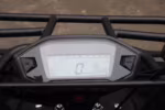 Motorcycle digital instrument cluster display showing speed and time