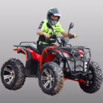 Rider on red and black ATV quad bike