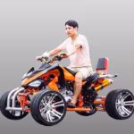 Man riding orange sport ATV quad bike