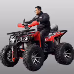 Man riding red ATV quad bike