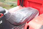 Motorcycle seat covered with protective plastic film