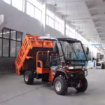 ATV utilitario naranja con caja basculante hidráulica de fábrica