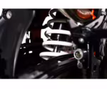 Motorcycle rear shock absorber with white coil spring
