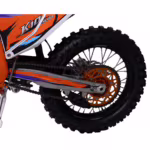 Dirt bike rear wheel with orange sprocket and chain