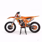 Orange dirt bike on display stand side view
