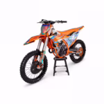 Orange dirt bike with holographic decals on white background