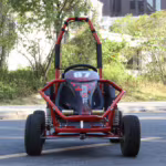 Red off-road go-kart with roll cage and large tires