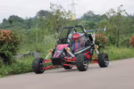 Off-road dune buggy with red and black frame