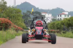 Off-road go-kart with red frame and black roll cage