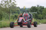Off-road go-kart with roll cage and large tires