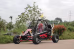 Red and black off-road dune buggy with roll cage