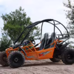 Orange off-road dune buggy with roll cage