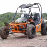 Orange off-road dune buggy on rocky terrain