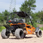 Orange off-road dune buggy on dirt terrain