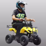 Rider on yellow mini ATV quad bike