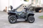 Green and black 4x4 ATV with large off-road tires
