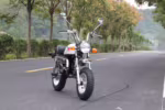 Honda Monkey style mini motorcycle on paved road