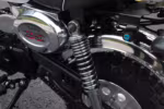 Monkey motorcycle engine with chrome shock absorber