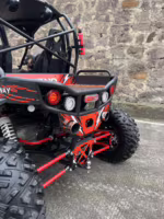 Rear view of red and black off-road UTV with dual exhaust pipes