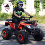 Rider on red YKF ATV quad bike