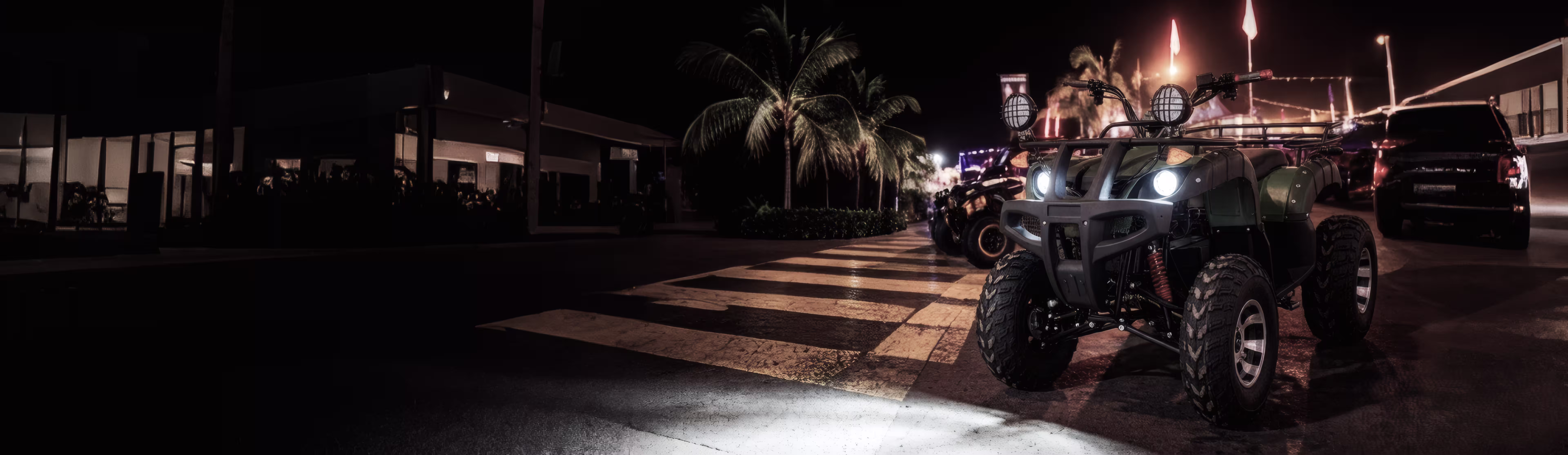 Electric ATV with headlights on at night