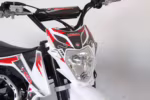 MEGA motorcycle front headlight and handlebar detail