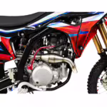 Dirt bike engine and exhaust system close-up view