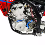 Motorcycle engine with blue components and chain drive