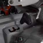 Motorcycle ignition key and gear shift lever close-up