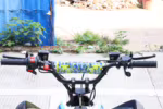 Motorcycle handlebar with blue yellow camo pad