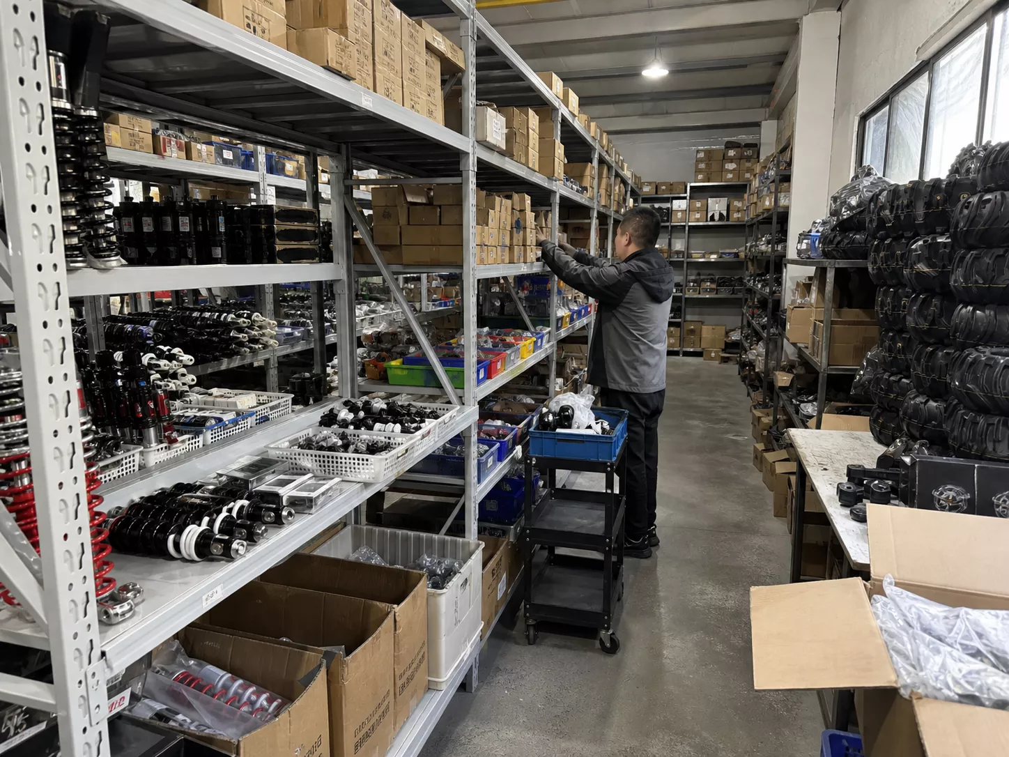 YKF MOTO spare parts warehouse with ATV and dirt bike replacement parts