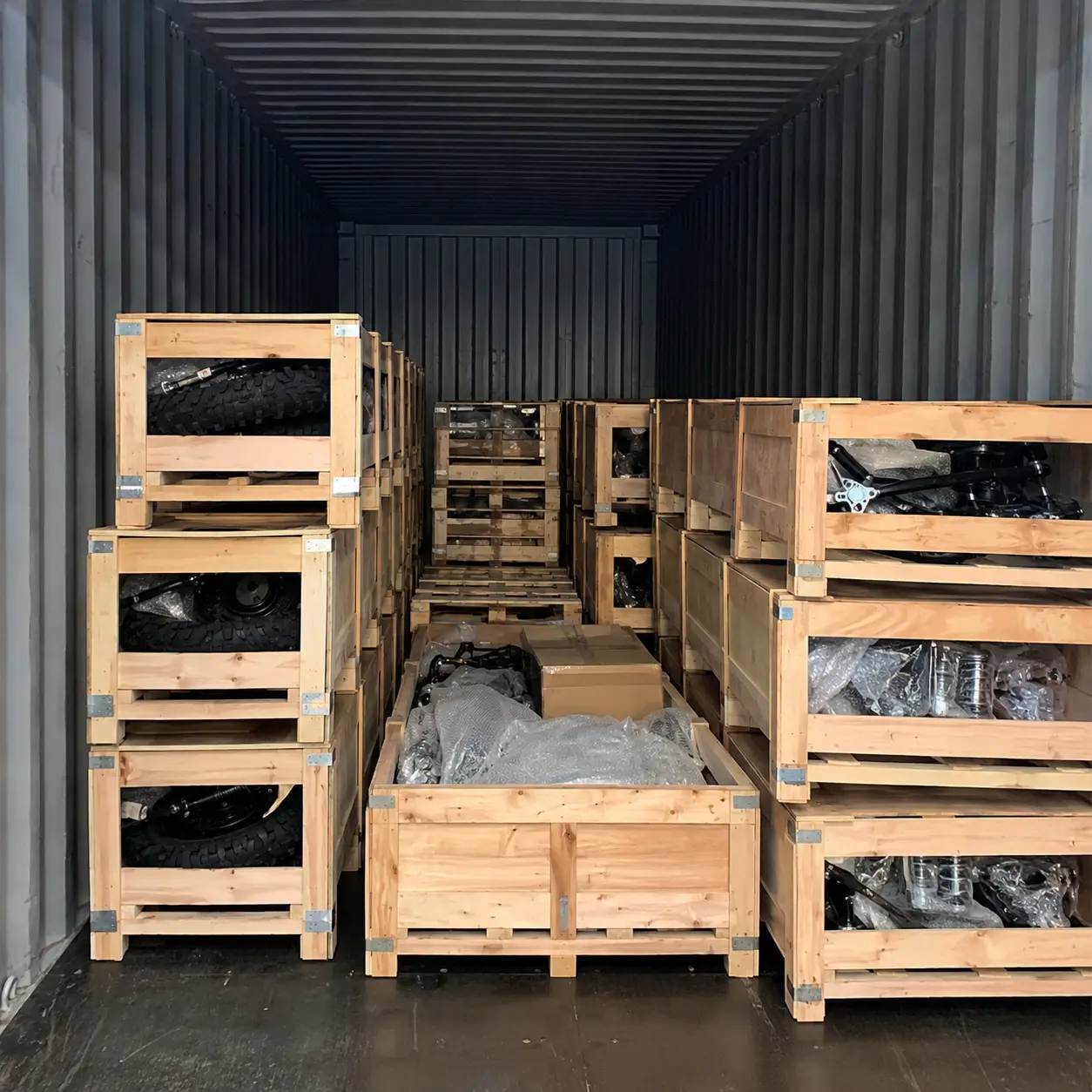 Crated dirt bikes packed inside a 40HQ shipping container